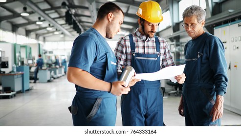 Supplier with engineer checking on production in factory