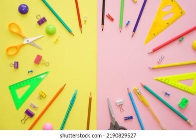 Supplies set on table, creative tools for school creative work on yellow and pink background stationery, colored pencils pens and markers copy space, flat lay