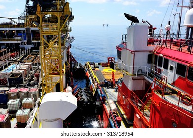 A supply boat docking at an offshore barge platform