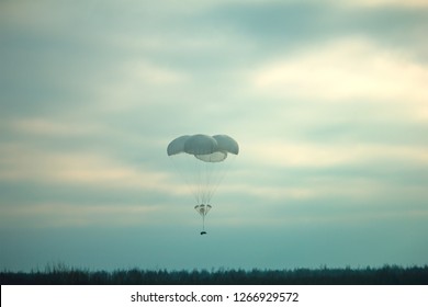 Supply Box Dropped With Parashute At Military Tactic Field