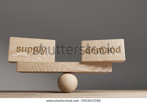 Supply and demand balance concept.\
Wooden cube block with words Supply and demand on\
seesaw.