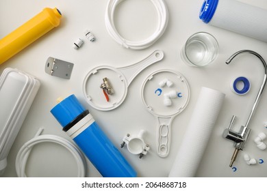 Supply Of Tools And Parts For The Maintenance And Repair Of Sanitary Water Treatment Equipment On A White Table. Top View. Horizontal Composition.