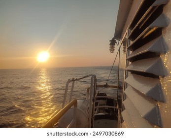 Supply vessel deck of boat in the Indonesian Sea at sunset or sunrise. - Powered by Shutterstock