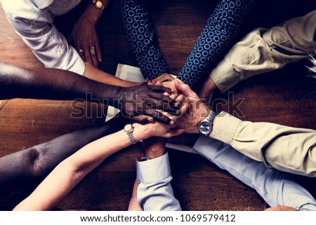 Support diverse hands together teamwork aerial view