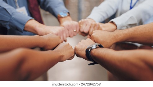 Support, fist bump and hands of business people in circle for teamwork with solidarity and community. Synergy, partnership and staff group with power sign together for workplace trust and cooperation