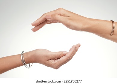 Support is a give and take. Cropped shot of two unrecognizable women posing with their hands cupped above each other. - Shutterstock ID 2251938277