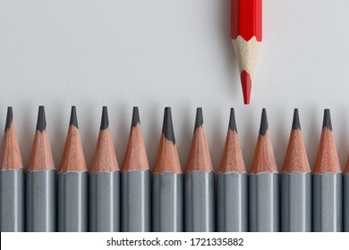 Support Group, Intervention. Conceptual. Red And Gray Pencils Opposite Each Other On An Isolated Background. Shallow Depth Of Field