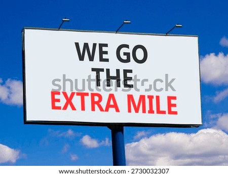 Support, help we go the extra mile symbol. Concept words We go the extra mile on beautiful big white billboard. Beautiful blue sky background. Business we go the extra mile concept. Copy space.