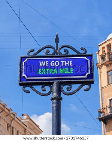 Support, help we go the extra mile symbol. Concept words We go the extra mile on beautiful blue road sign. Beautiful blue sky background. Business we go the extra mile concept Copy space