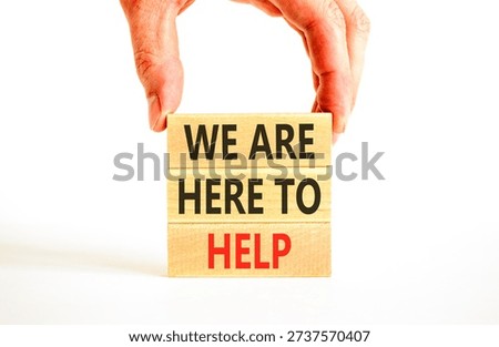 Support, help and we are here to help symbol. Concept words We are here to help on beautiful wooden blocks. Beautiful white background. Business we are here to help concept. Copy space.