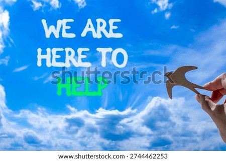 Support, help and we are here to help symbol. Concept words We are here to help on beautiful sky. Beautiful blue sky background. Businessman's hand. Business we are here to help concept. Copy space.