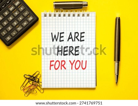Support, help and we are here for you symbol. Concept words We are here for you on beautiful white note. Beautiful yellow background. Black pen. Business we are here for you concept. Copy space.