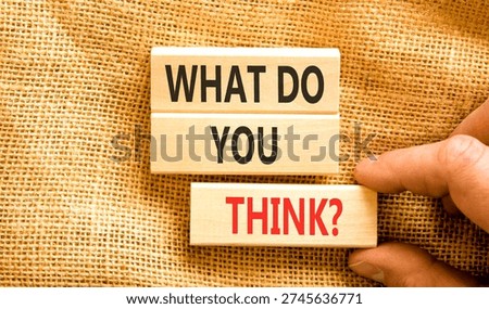 Support, help what do you think symbol. Concept words What do you think on beautiful wooden blocks. Beautiful canvas background. Businessman's hand. Business what do you think concept. Copy space.