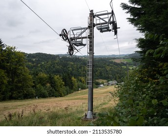 Support Post Of Disc Or T-bar Ski Lift, Used To Pull Skiers Or Snowboarders Up Along The Slope. Stanchion And Pulley Mechanism. Resort Closed During Summer Season And COVID-19 Coronavirus Pandemic.