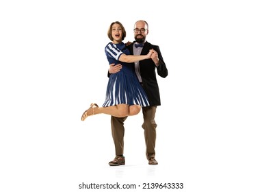 Support, Relation. Couple Of Dancers, Young Man And Woman In Vintage Retro Style Outfits Dancing Swing Dance Isolated On White Background. Timeless Traditions, 60s, 70s Fashion Style.