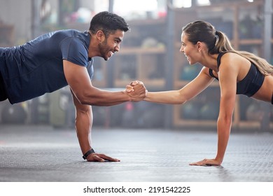 Support, teamwork and fitness couple doing workout training, challenging exercise for endurance, strength and stamina in a gym. Active, fit man and woman giving support and motivation during pushup - Shutterstock ID 2191542225