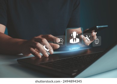 IT support, Technical support customer service concept, User hand using computer laptop with VR screen support customer icon, Technology internet concept, call center and customer service help 24 hrs. - Powered by Shutterstock