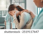 Support, therapist and woman crying in counseling office for professional care, consultation and stress. Mental health, helping hand and psychologist with medical advice for patient on sofa in clinic