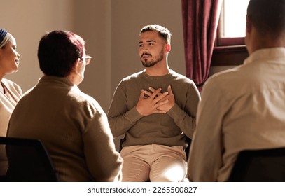 Support, trust and man sharing in group therapy with understanding, feelings and talking in session. Mental health, addiction or depression, men and women with therapist sitting together for healing.