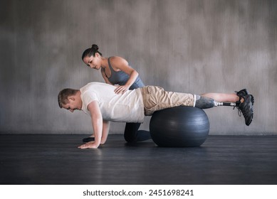 Support, woman and physiotherapy with prosthetic leg for amputee at sports center in training. Physiotherapist, patient and fitness for workout, gym ball and trainer for man with a disability - Powered by Shutterstock