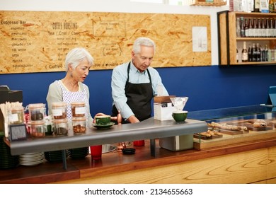 Support your local bakery. Shot of a senior couple running a small business together. - Powered by Shutterstock