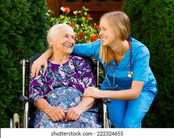 Supporting young doctor with elderly patient at the nursing home.