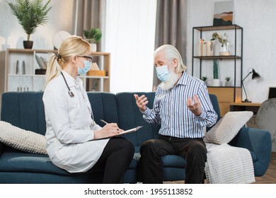 Supportive Attentive Female Nurse Or Doctor Visits Senior Man Patient At Home, Listens To His Complaints. Doctor Consulting Mature Retired Man At Home. Post Covid Syndrome And Healthcare Concept