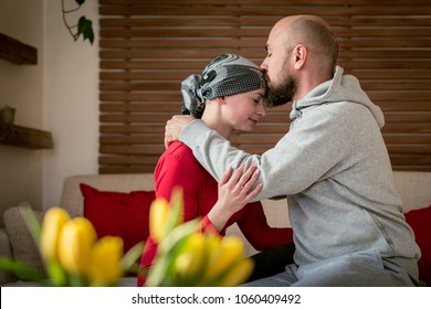 Supportive Husband Kissing His Wife, Cancer Patient, After Treatment In Hospital. Cancer And Family Support Concept.