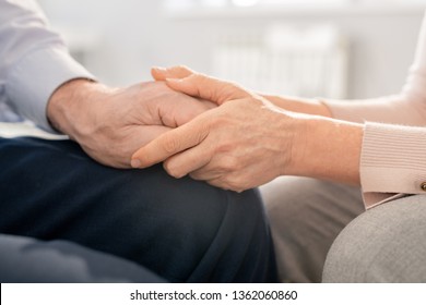 Supportive mature woman holding hand of senior man while taking care and expressing sympathy - Shutterstock ID 1362060860