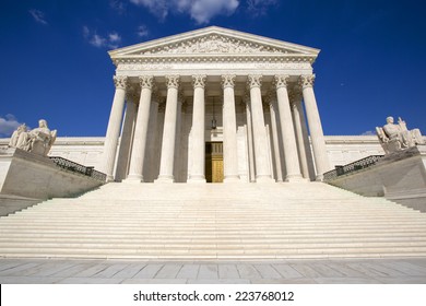 Supreme Court of the United States in Washington D,C. Blue sky behind.