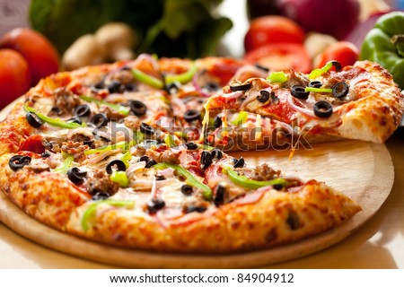 Supreme Pizza lifted slice 1