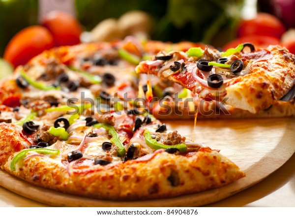 Supreme Pizza Lifted Slice Stock Photo (Edit Now) 84904876