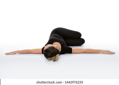 Supta Matsyendrasana yoga pose (Reclined Spinal Twist pose). Yoga poses woman isolated with white background. Yoga pose set. Mindfulness and Spiritually concept. Girl practicing Hatha Yoga asanas.  - Powered by Shutterstock