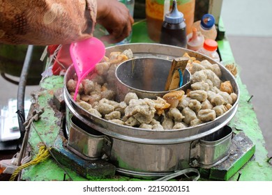 Surabaya 2 Oct 2022 - Indonesian Street Food Vendor Is Selling Pentol Bakso Meat Ball With A Traditional Wooden Cart During The Day