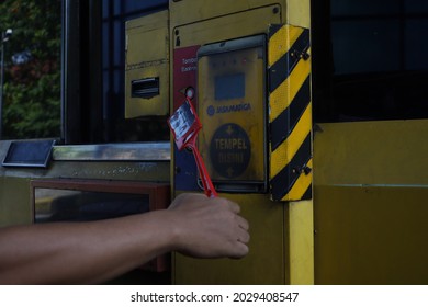 Surabaya, August 21, 2021. Attaching E-Money To The EDC Machine At The Toll Gate. Cashless Payment System