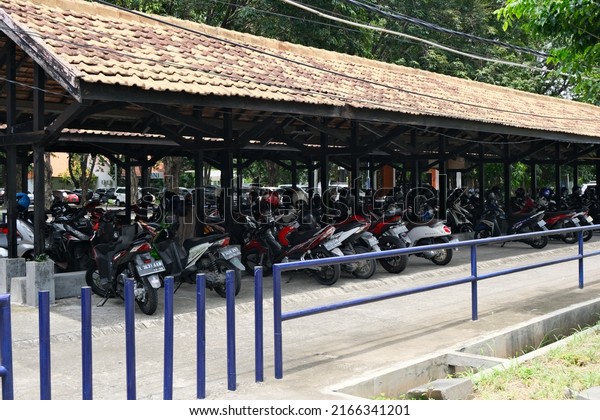 Surabaya, East Java - Februari 2022: Motorcycle
parking lot, with
roof