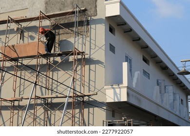 surabaya, east java, indonesia: scaffolding erected to assist with construction. March 11, 2023