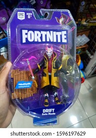 Surabaya, Indonesia - 18/12/2019 : Hand Hold A Drift Fortnite Character Toy Display For Sale At Toys Store