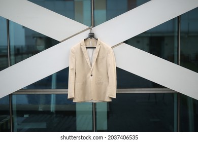 Surabaya, Indonesia, 2021: White Coat Hanging In Front Of The Building