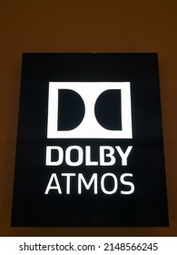 Surabaya, Indonesia - April 12, 2022. The Dolby Atmos Logo On Display In The Hallway Of The Cinema Waiting Room