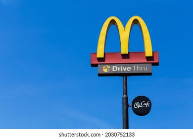 SURABAYA, INDONESIA – August 2021 : A Neon Sign Above A McDonalds Restaurant-drive Thru In Surabaya.