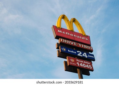 SURABAYA, INDONESIA – August 2021 : A Neon Sign Above A McDonalds Restaurant-drive Thru In Surabaya.