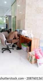 Surabaya, Indonesia, December 6, 2021. Front Office Staff Is On Duty While Checking Goods