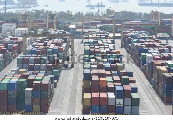 Surabaya, Indonesia - July 2, 2018: View\
of container terminal at  the port of Surabaya Petikemas Terminal\
(TPS), Tanjung Perak, Surabaya, East Java,\
Indonesia