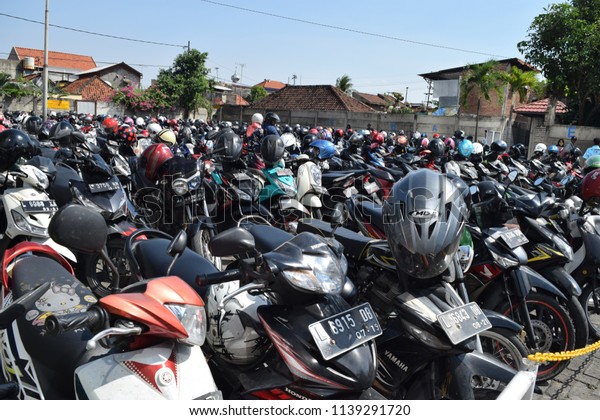 Surabaya, Indonesia - May 12, 2018:\
Motorcycles parked lined at Parking Tunjungan Plaza, Surabaya, East\
Java,  Indonesia\
