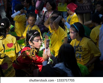 SURABAYA, INDONESIA - MAY 27, 2012: Young Tari Remo (Remo Dance) Kids Dancers, Traditional Dance Of East Java, Are Preparing Back Stage By Putting On Their Makeup Before Their Performance 