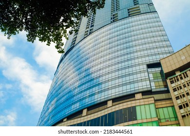 Surabaya,east Javaindonesia - 2022: Portrait Photo Of A Tall Building Taken From Below With Glass As The Wall