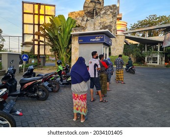 Surabaya-Indonesia, August 31, 2021 : Long Queue Of People Queuing To Withdraw Cash At ATM. Bank Mandiri ATM