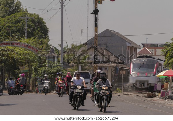 Surakarta, Central\
Java Indonesia - September 08,2018 : Railbus Bathara Kresna\
crossing Slamet Riyadi street. This railbus operates on the\
Surakarta Purwosari-Wonogiri\
route.