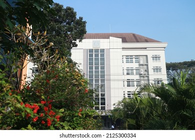 Surakarta, Indonesia - January 13 2022: White Tall Old Building Surrounded By Green Tree 